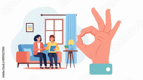 Two women on couch, large hand shows okay sign