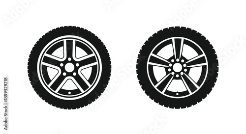 Two car wheels in a stark black outline silhouette