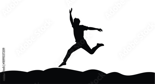 Joyful silhouette of a person leaping with arms outstretched against a bright background