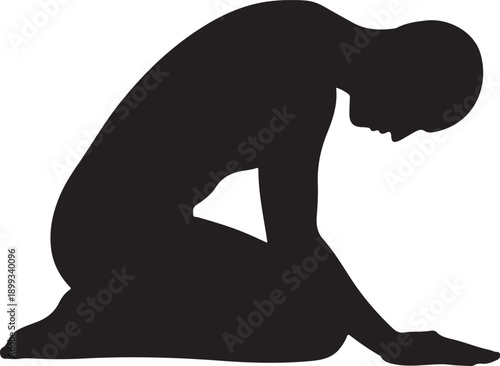 Man praying on mat kneeling bowing