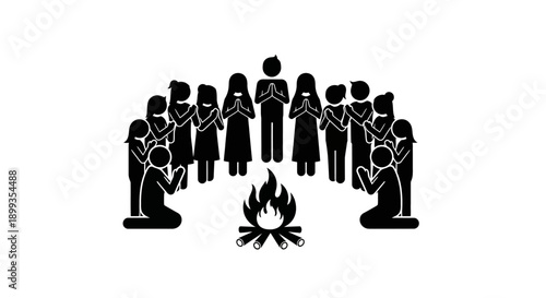 Group of people gathered around a campfire, praying or performing a ritual, symbolizing community and spirituality.