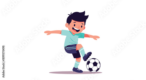 Active young boy in a blue and green sports uniform kicks a soccer ball fast with a happy and determined smile.