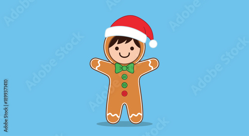 Cute little boy dressed in a brown gingerbread man costume with a red santa hat celebrating the festive christmas holiday season.