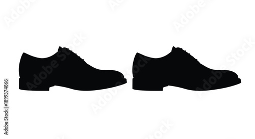 Two black shoes positioned side by side a striking silhouette