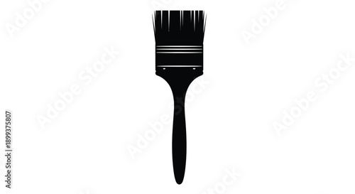 A single black paintbrush shown in a stark silhouette