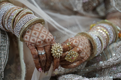 Indian bride's hands adorned with henna.
