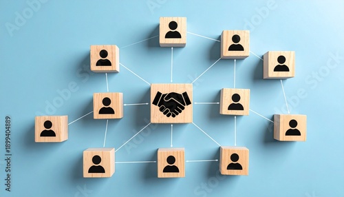Network of wooden blocks on a light blue background, each block featuring a black icon—most with person symbols and one central block with a handshake icon—connected by white lines and dots forming a 