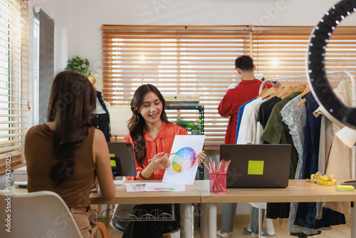 Young woman discussing color palette for online fashion business