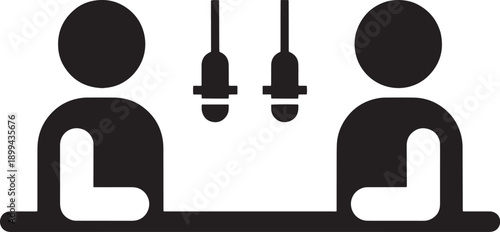 Podcast studio with two people sitting at a table with microphones in front of them, representing interview or discussion