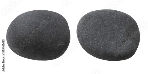 Two different sides of the same stone, isolated on a white background. Close-up of the pebble texture.