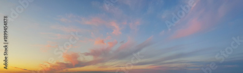 Panoramic landscape with sunset sky, sun and gold