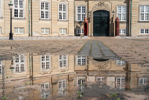 Wall Mural The Royal Palace of Copenhagen reflected in a rain puddle.
