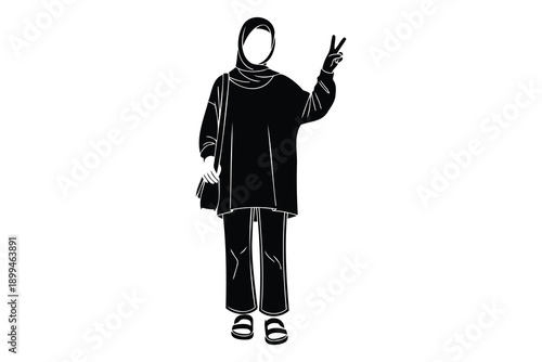 woman wearing hijab and making peace sign with one hand  standing alone