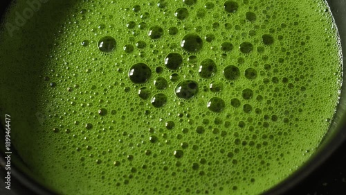 Wallpaper Mural Vibrant green matcha latte being poured into a glass Torontodigital.ca