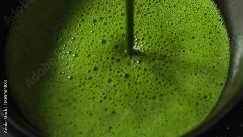 Wallpaper Mural Vibrant green matcha latte being poured into a glass Torontodigital.ca