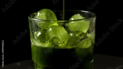 Wallpaper Mural Vibrant green matcha latte being poured into a glass Torontodigital.ca