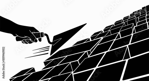 Hand building a wall with trowel and bricks, symbolizing construction and progress.