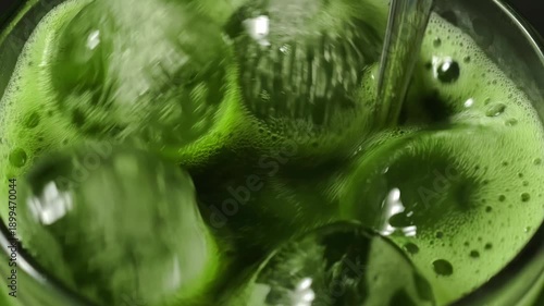 Wallpaper Mural Vibrant green matcha latte being poured into a glass Torontodigital.ca