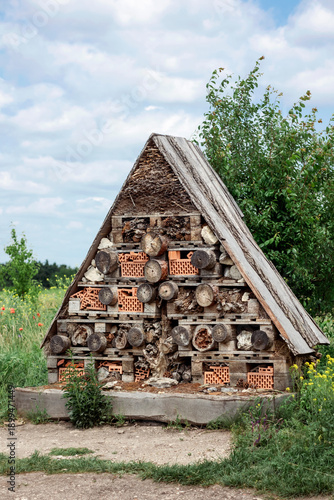 Bug Hotel or Insect House in Green Field. Handmade Attract Bug Hotel Guests.
