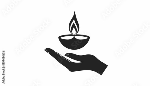 Hand holding a diya with a lit flame symbolizing spirituality and culture.