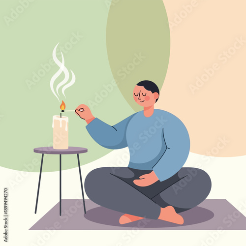Man sitting cross-legged with candle.