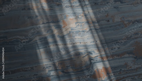 Light and Shadow Create Patterns on a Stone Surface in a Quiet Indoor Space D...