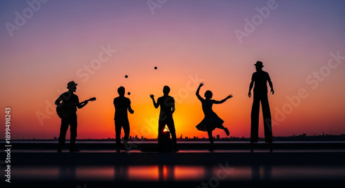 Silhouette of happy friends playing music and dancing at colorful sunset on beach