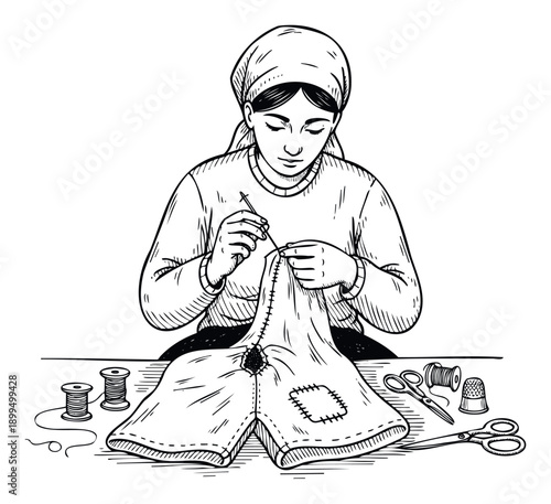A focused woman wearing a headscarf is meticulously darning a piece of clothing with needle and thread at a table, representing handicraft and sustainable living for various DIY hobby or