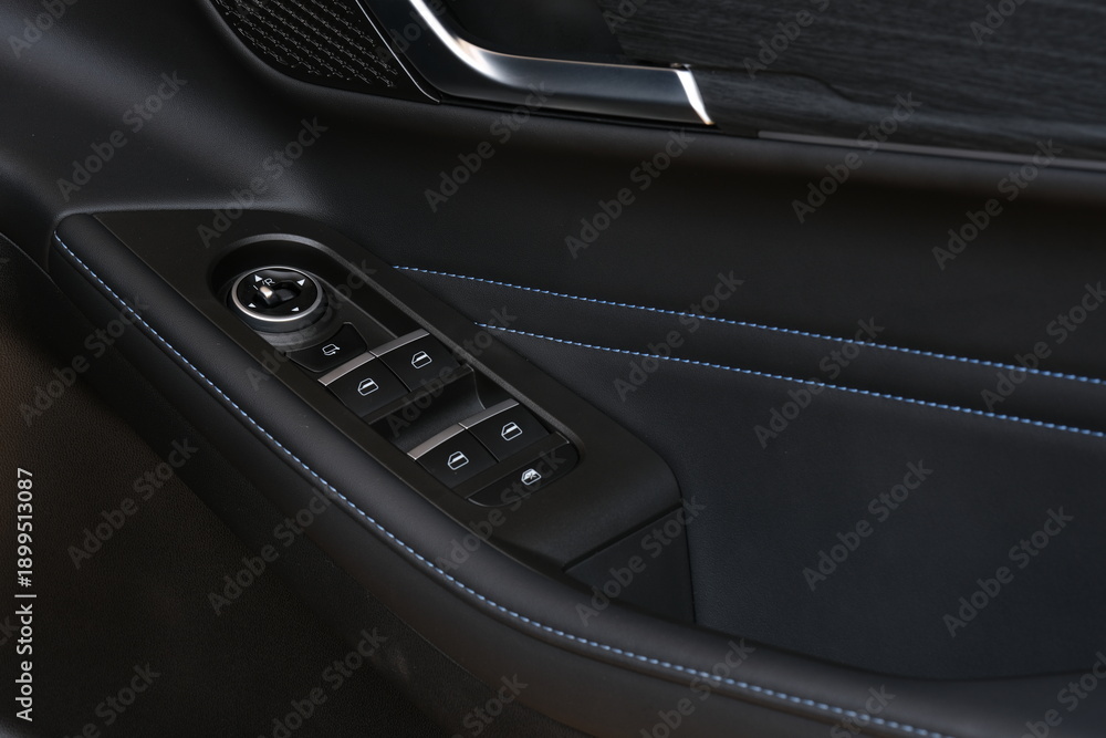 Obraz premium Premium electric car cabin detail with modern door panel design and advanced control interface. Suitable for commercial advertising and future transportation visual themes.