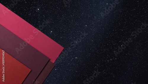 Colorful Paper Sheets Arranged Against a Backdrop of a Starry Night Sky