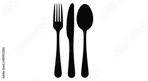 Cutlery arrangement of fork knife and spoon a dark silhouette