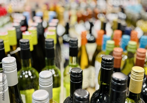 Colorful Assortment Of Wine Bottles Creating Upscale Shopping Atmosphere. Gourmet Retail Setting Showcasing Curated Wine Selection With Vibrant Display And Focus On Details