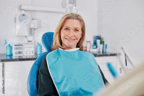 Happy mature woman smiling  at dentist