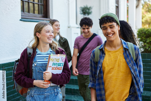 Multethnic students laughing outside campus