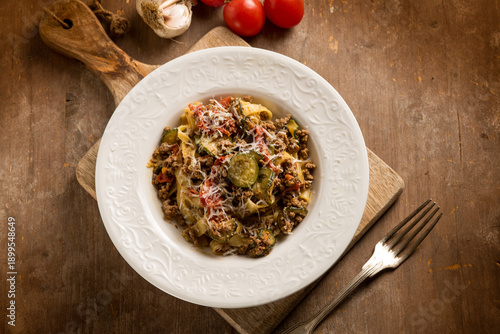 Tagliatelle with white ragout zucchinis and tomatoes