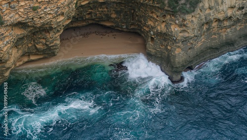 Waves Crashing on Beach Near Rocky Cliffs at Sunset in Coastal Area