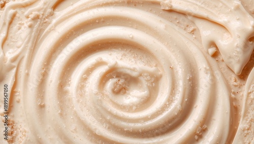 Creamy Texture of a Light Colored Spread on a Wooden Surface in a Kitchen Set...