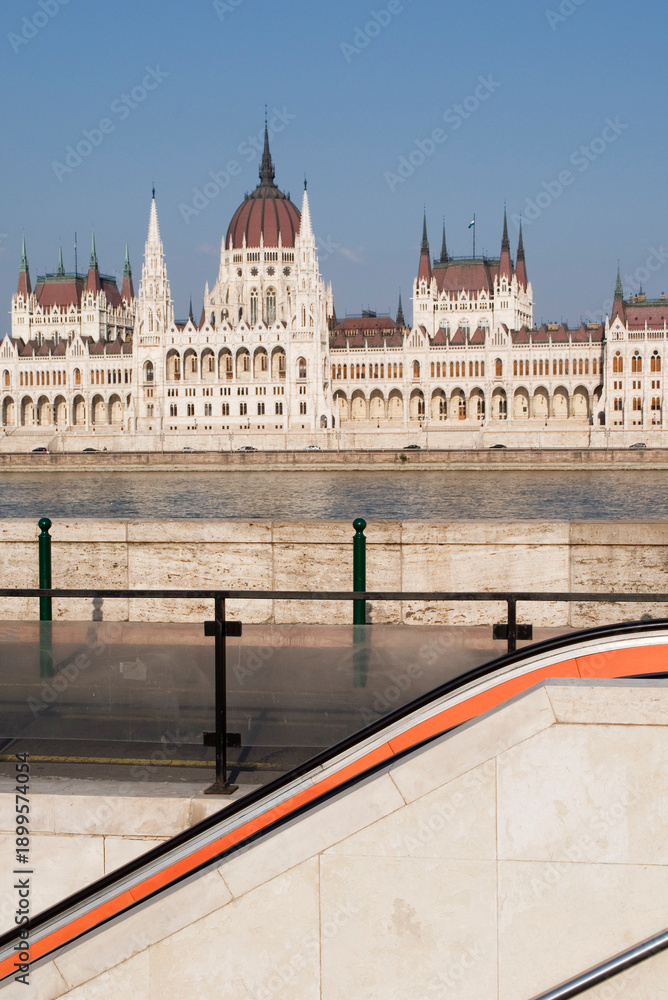 Fototapeta premium metro staircase, Danube river and the Hungarian National Assemby Parliament Országház in the background, Budapest Hungary