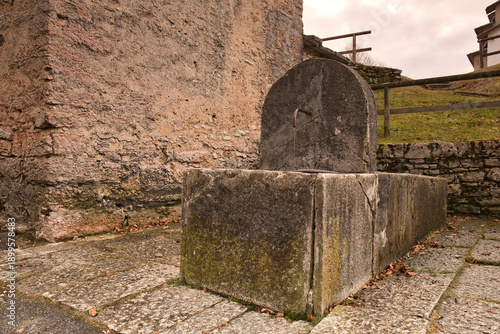 old grave stone.Historical fountains in Italy represent a monumental artistic heritage, with iconic examples that blend art, engineering and myth in royal squares and gardens. Among the most famous.
