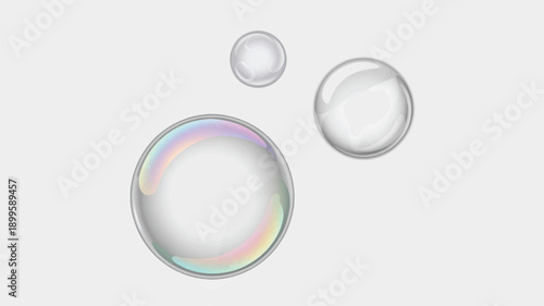 Transparent Soap Bubbles in Soft Focus with Rainbow Reflections on White Background for Advertising