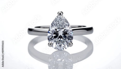 A close-up of a pear-shaped diamond ring