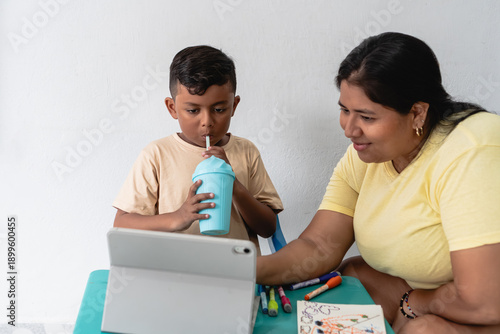 Photos Mother and son engaging in early childhood digital learning