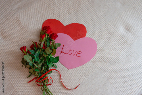 Red roses bouquet with heart decoration - Valentine's day concept.