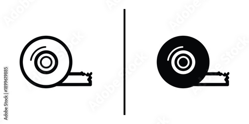 A simple black and white illustration of two reels with tape