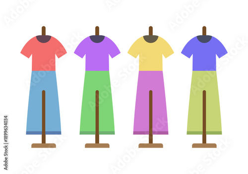 Cuatro maniquíes con conjuntos de ropa colorida de camisetas y pantalones 