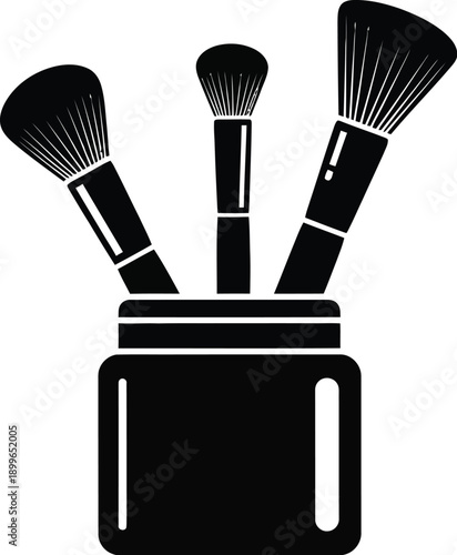 Makeup brushes in a holder.