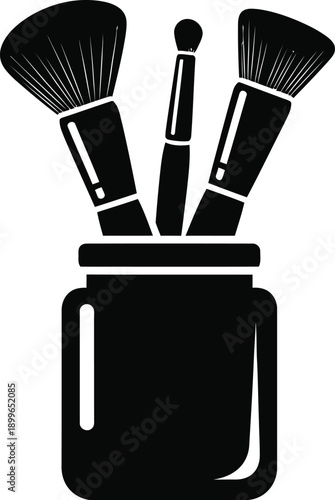 Makeup brushes in a holder.