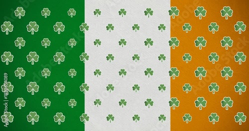 Digital animation of multiple clover leaves moving against irish flag