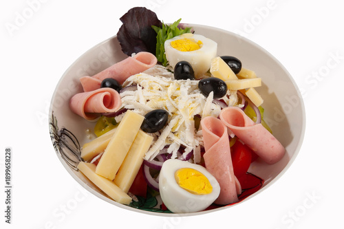 Salad with ham, tomatoes, eggs, olives, yellow cheese and onion