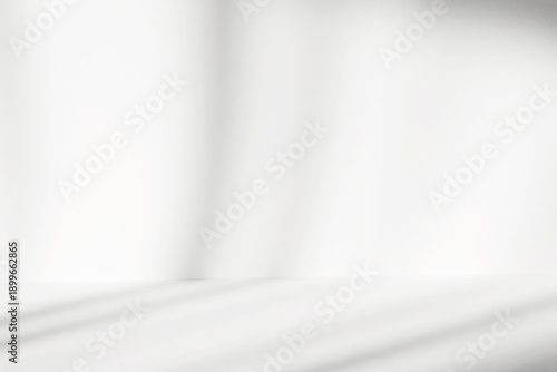 Abstract white studio background with shadows of window. Empty 3d room. Display product with blurred backdrop.